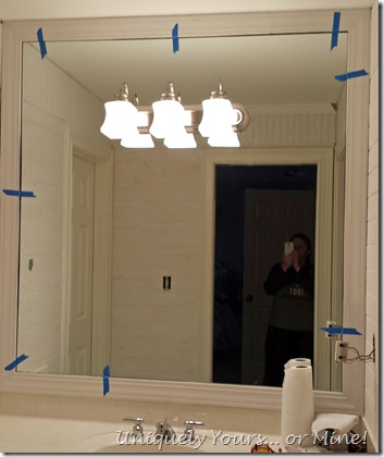 Installing a frame around a bathroom mirror