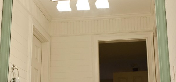 Installing a frame around a bathroom mirror