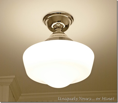 Schoolhouse light in bathroom tub shower area