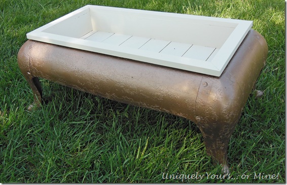 upcycled antique iron stove base into planter