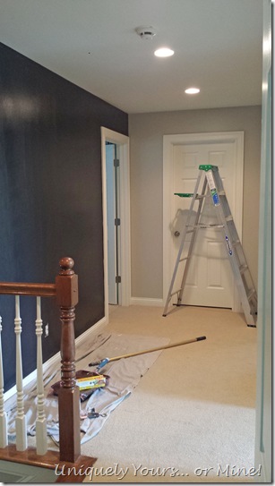 Hallway with black accent wall