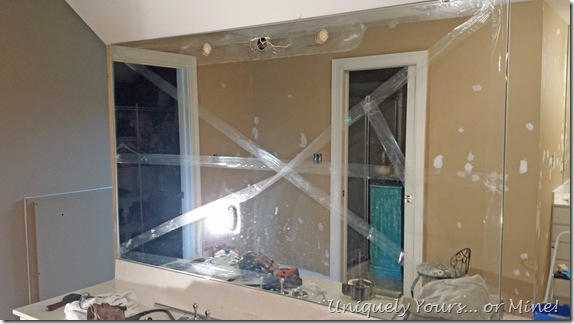 Removing glued on mirrors from wall