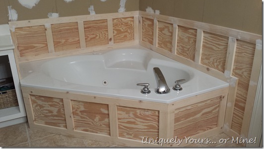 Installing wainscoting around bathtub in master bathroom