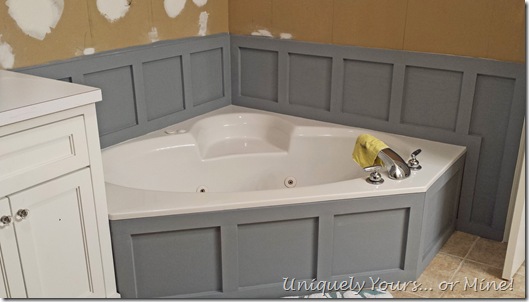 Installing wainscoting around bathtub in master bathroom