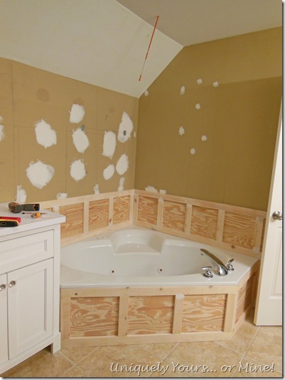 Installing wainscoting around bathtub in master bathroom