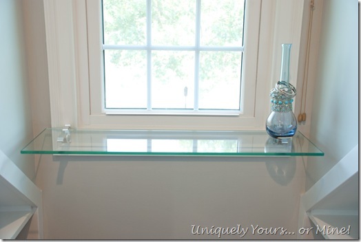 Floating glass shelf in dormer window area
