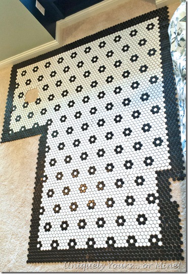Dry layout of black and white mosaic tiles with flowers