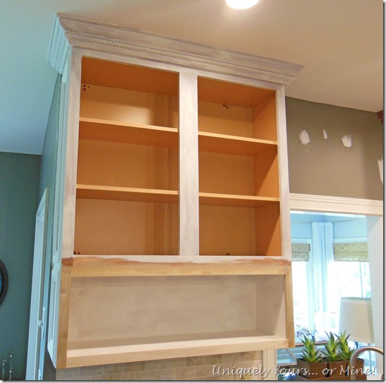 Raising kitchen cabinets and adding open cabinets below