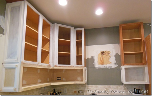 Raising kitchen cabinets and adding open cabinets below