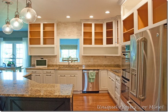 Kitchen cabinets painted and raised to ceiling