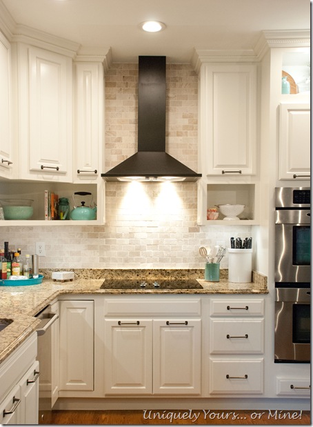 Final stage of DIY kitchen remodel, raised kitchen cabinets, open cabinetry, painted cabinets