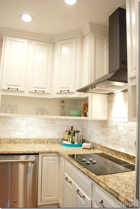 Final stage of DIY kitchen remodel, raised kitchen cabinets, open cabinetry, painted cabinets