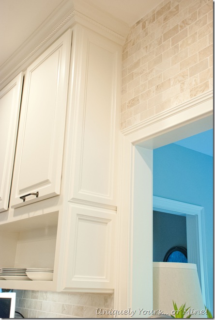 Final stage of DIY kitchen remodel, raised kitchen cabinets, open cabinetry, painted cabinets