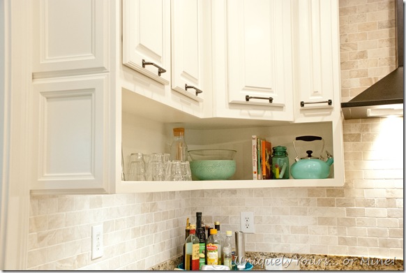 Final stage of DIY kitchen remodel, raised kitchen cabinets, open cabinetry, painted cabinets