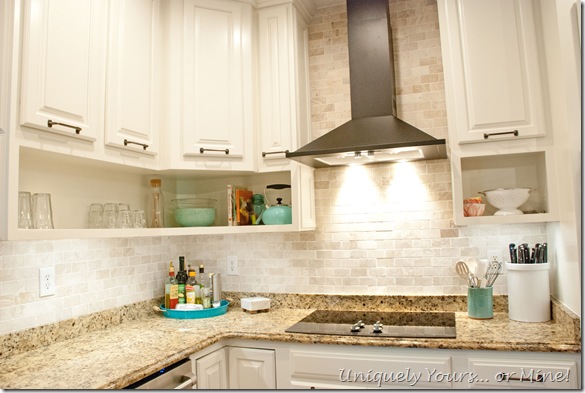 Final stage of DIY kitchen remodel, raised kitchen cabinets, open cabinetry, painted cabinets