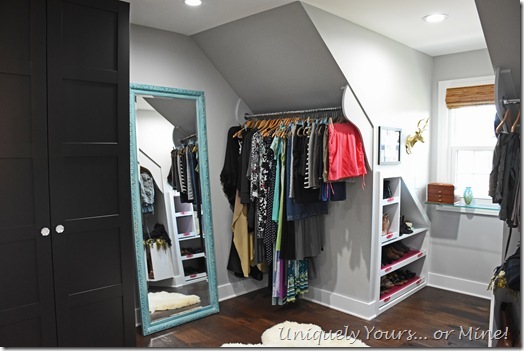 Slanted ceiling hanging space in renovated closet turned dressing room