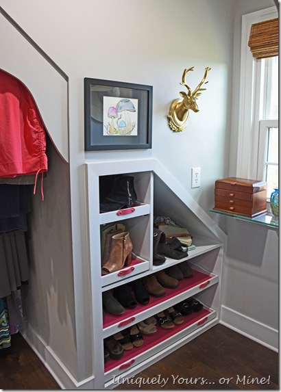 Custom built-in shoe shelves in renovated closet turned dressing room