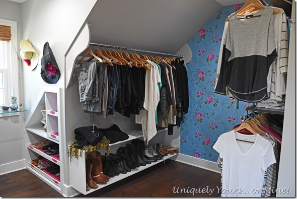 Slanted ceiling clothes hanging space in renovated closet turned dressing room